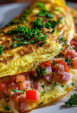 Omelette mit Putenschinken, Käse und Tomaten
